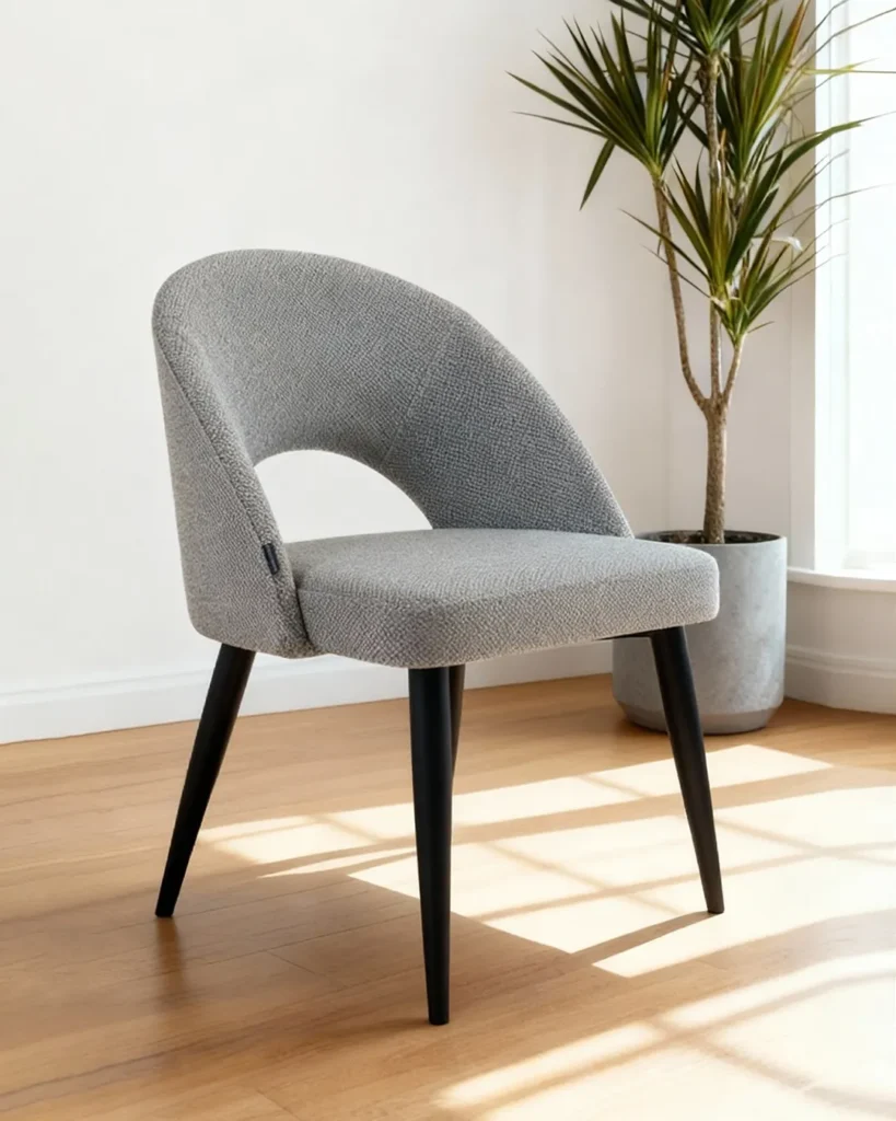 Modern upholstered accent chair with curved silhouette