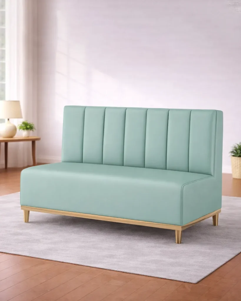 Soft-toned architectural sofa with refined brass detailing
